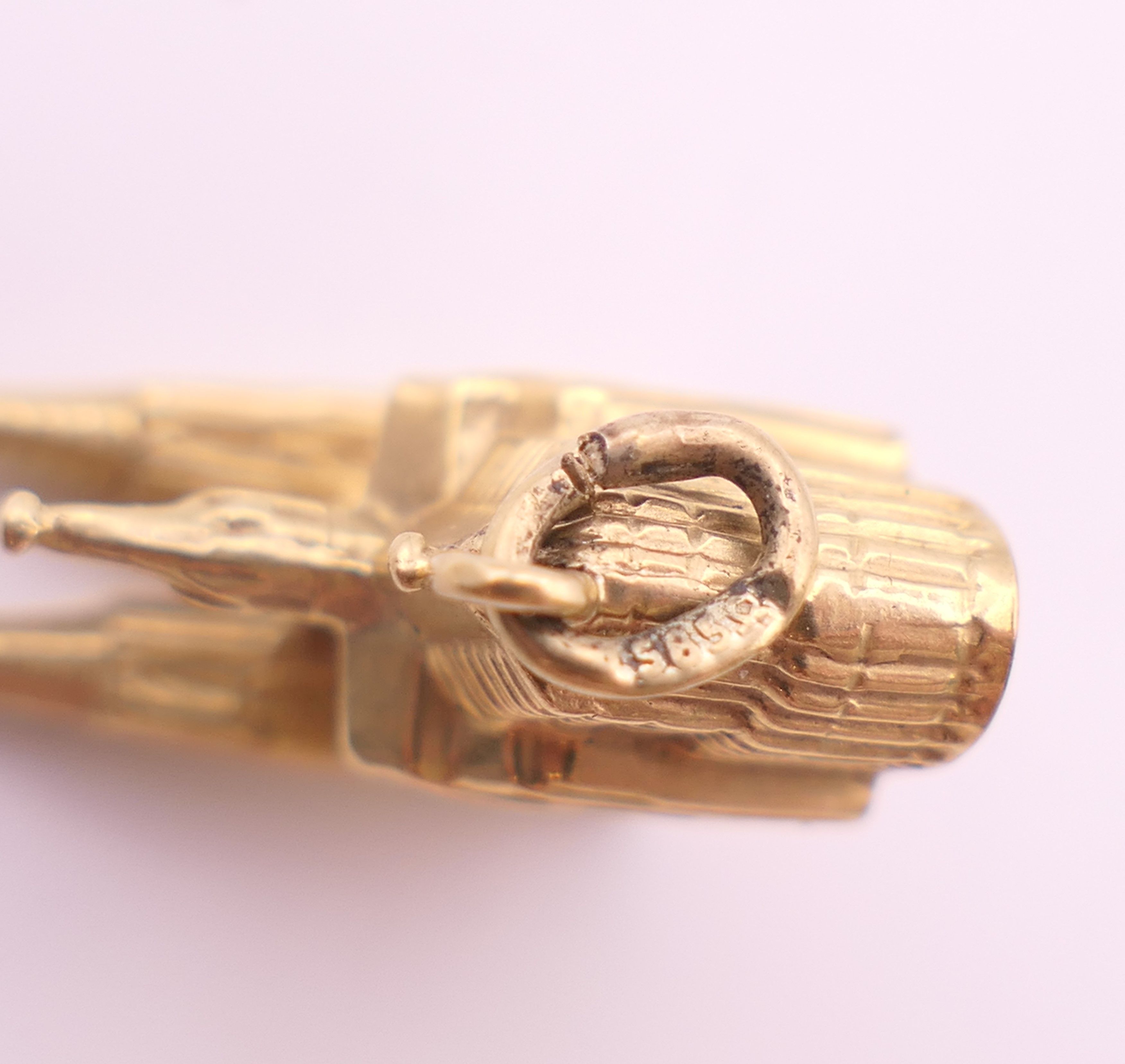 A 9 ct gold bracelet and charms. Bracelet 18 cm long. 58.6 grammes. - Image 7 of 17