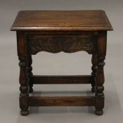 A small 20th century oak single drawer side table. 45.5 cm wide.