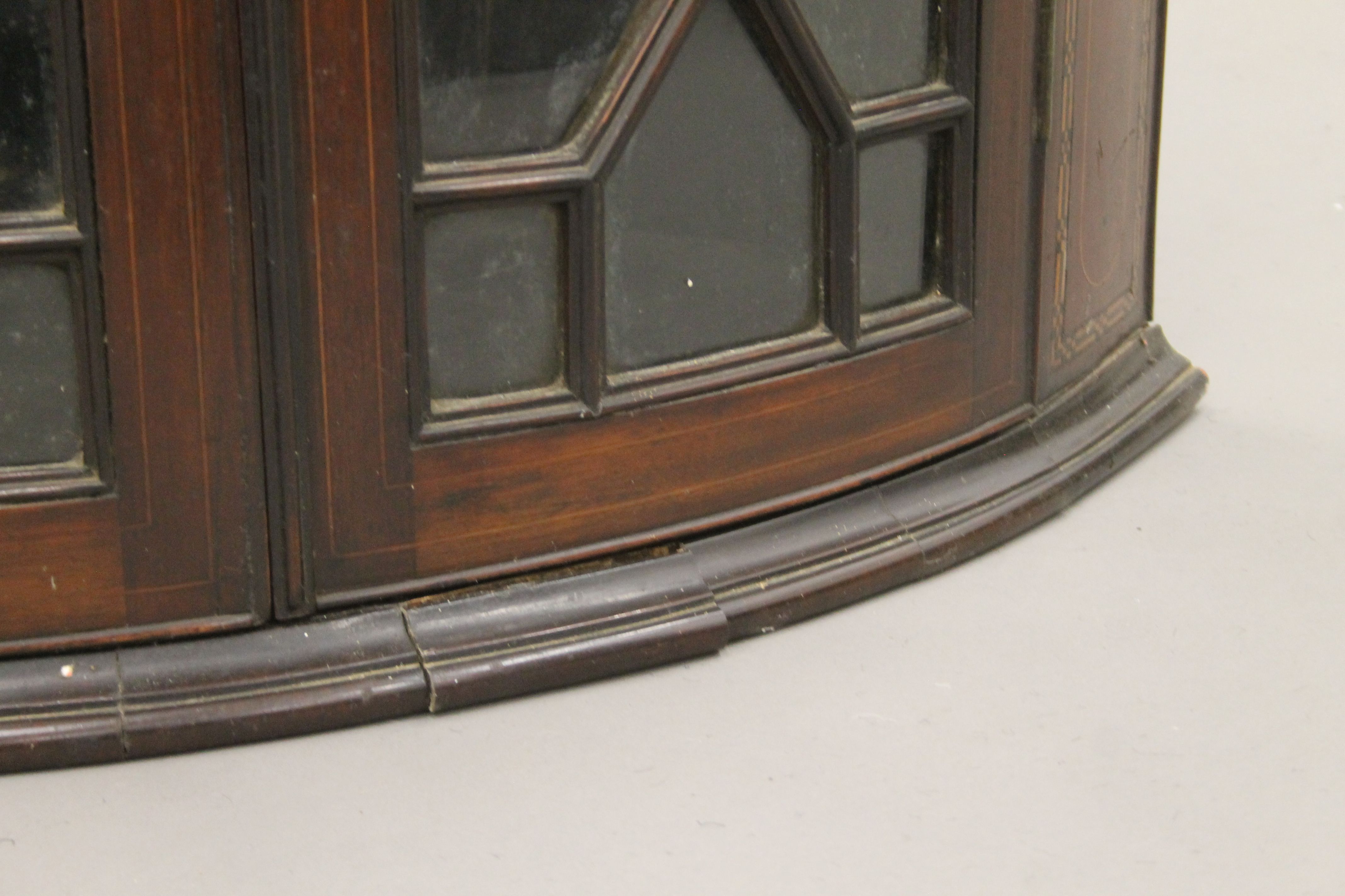 A George III inlaid mahogany glazed hanging corner cabinet. 69 cm wide. - Image 5 of 5