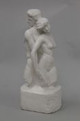 A cast plaster sculpture of two lovers, possibly Adam and Eve, bearing signature C Rivere.