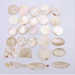 A small quantity of 19th century mother of pearl counters. Fish shape 5.75 cm long.