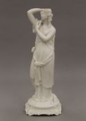 A Parian candle holder modelled in the form of a Grecian maiden. 32.5 cm high.