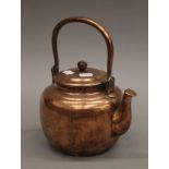 A Japanese copper teapot decorated with a mountainous scene and calligraphy. 27 cm long.