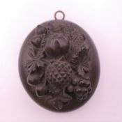 A mourning pendant locket. 5 cm high.