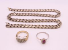 A silver and cubic zirconia ring, another ring and a chain. Chain 47 cm long.