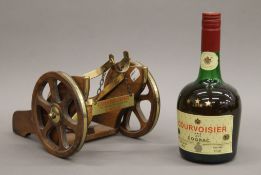 A bottle of Courvoisier Luxe Cognac mounted on a cannon form mount.