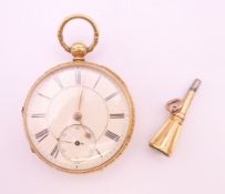 An 18 ct gold pocket watch with key, hallmarked Chester 1875. 5 cm diameter. The watch 95.