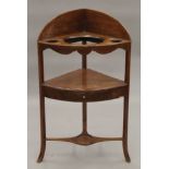 A George III mahogany corner washstand. 60 cm wide.