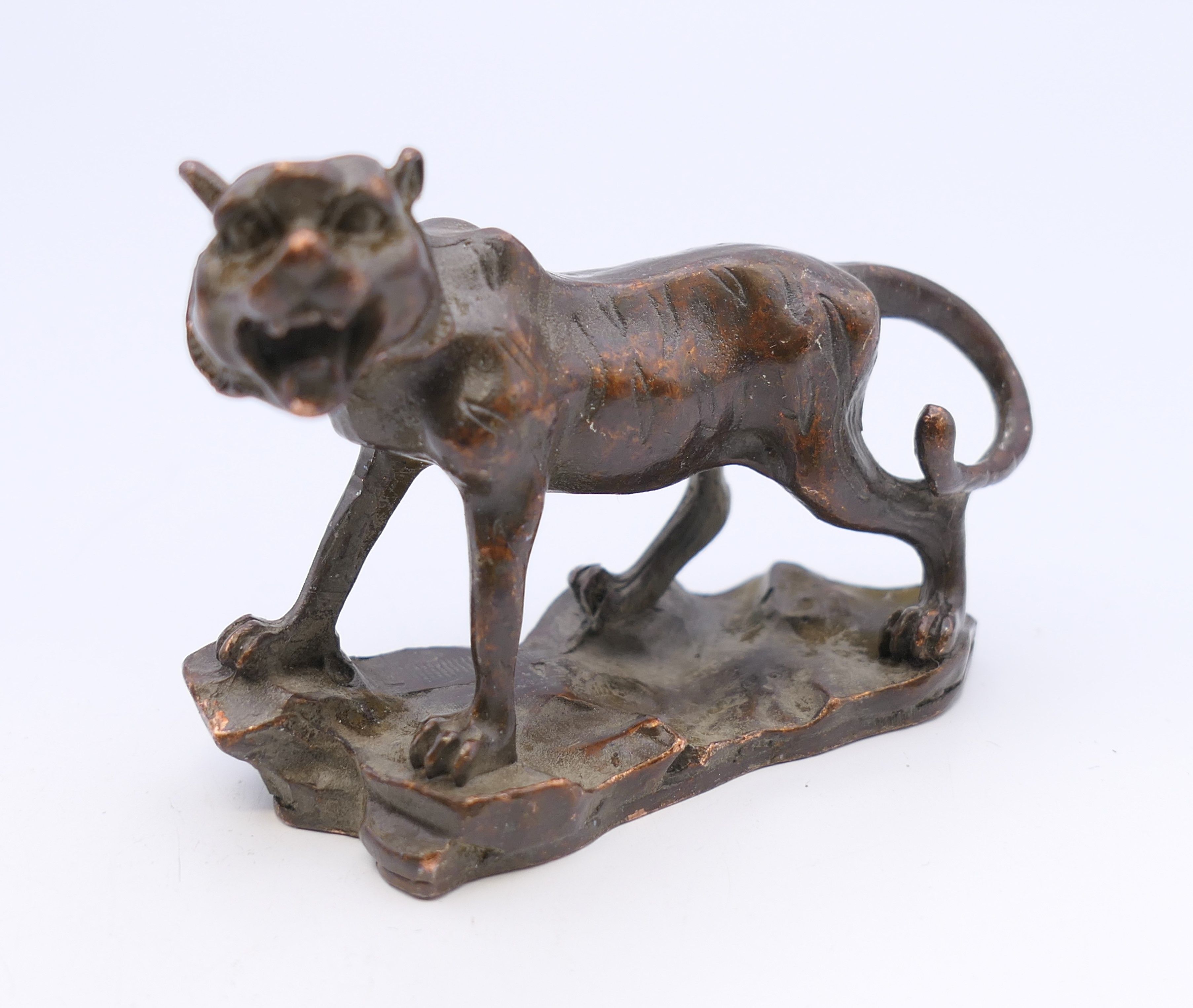 A bronze model of a tiger. 5.5 cm high, 6.5 cm long. - Image 3 of 4