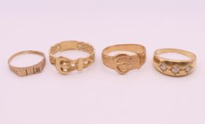 Four 9 ct gold rings. 13.4 grammes total weight.
