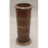 A brass bound mahogany umbrella stand of coopered construction. 66 cm high.