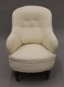 An upholstered Victorian nursing chair. 63 cm wide.