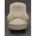 An upholstered Victorian nursing chair. 63 cm wide.