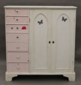 A white and pink painted pine food cupboard and a 20th century bookcase.