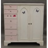 A white and pink painted pine food cupboard and a 20th century bookcase.