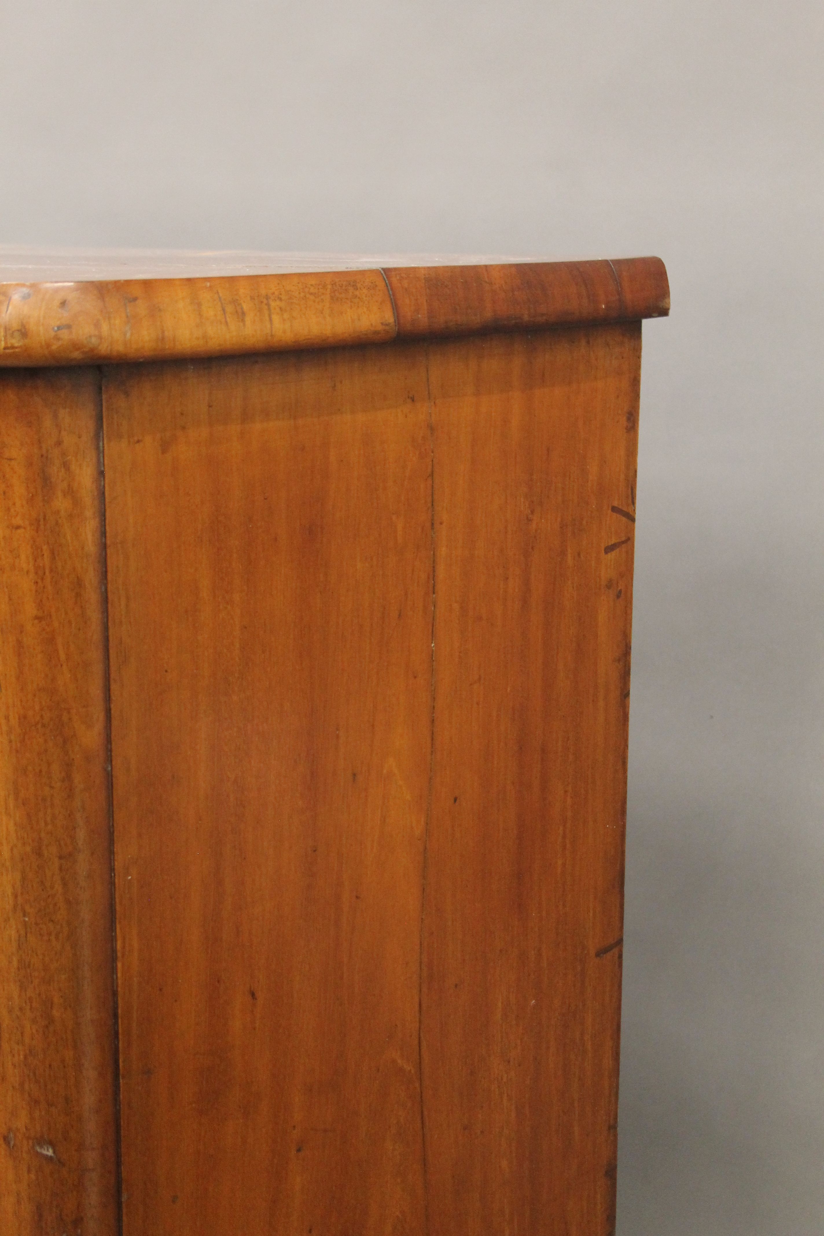 A Victorian mahogany bow front chest of drawers. - Image 7 of 9