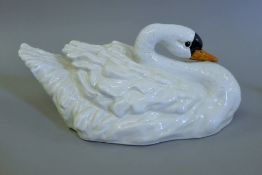 A porcelain swan. 41 cm long.