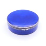 A silver and enamel powder compact. 7 cm diameter.