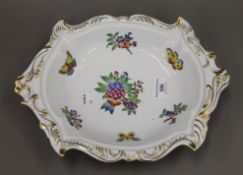 An Herend porcelain shaped dish decorated with butterflies and flowers. 31 cm long.