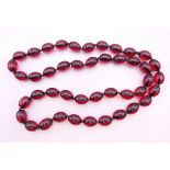 A bead necklace. 78 cm long.