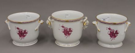 Three Herend porcelain cache pots. The largest 13 cm high.