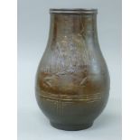 A Japanese patinated iron vase. 30 cm high.