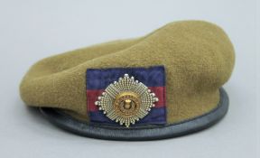 A Firmin Beret with cap badge. 19 cms wide.