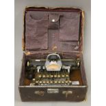 An antique Blickensderfer typewriter with leather case.