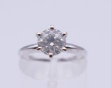 A 14 ct white gold diamond solitaire ring, (diamond 1.