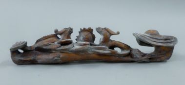 A wooden ruyi sceptre. 41 cm high.