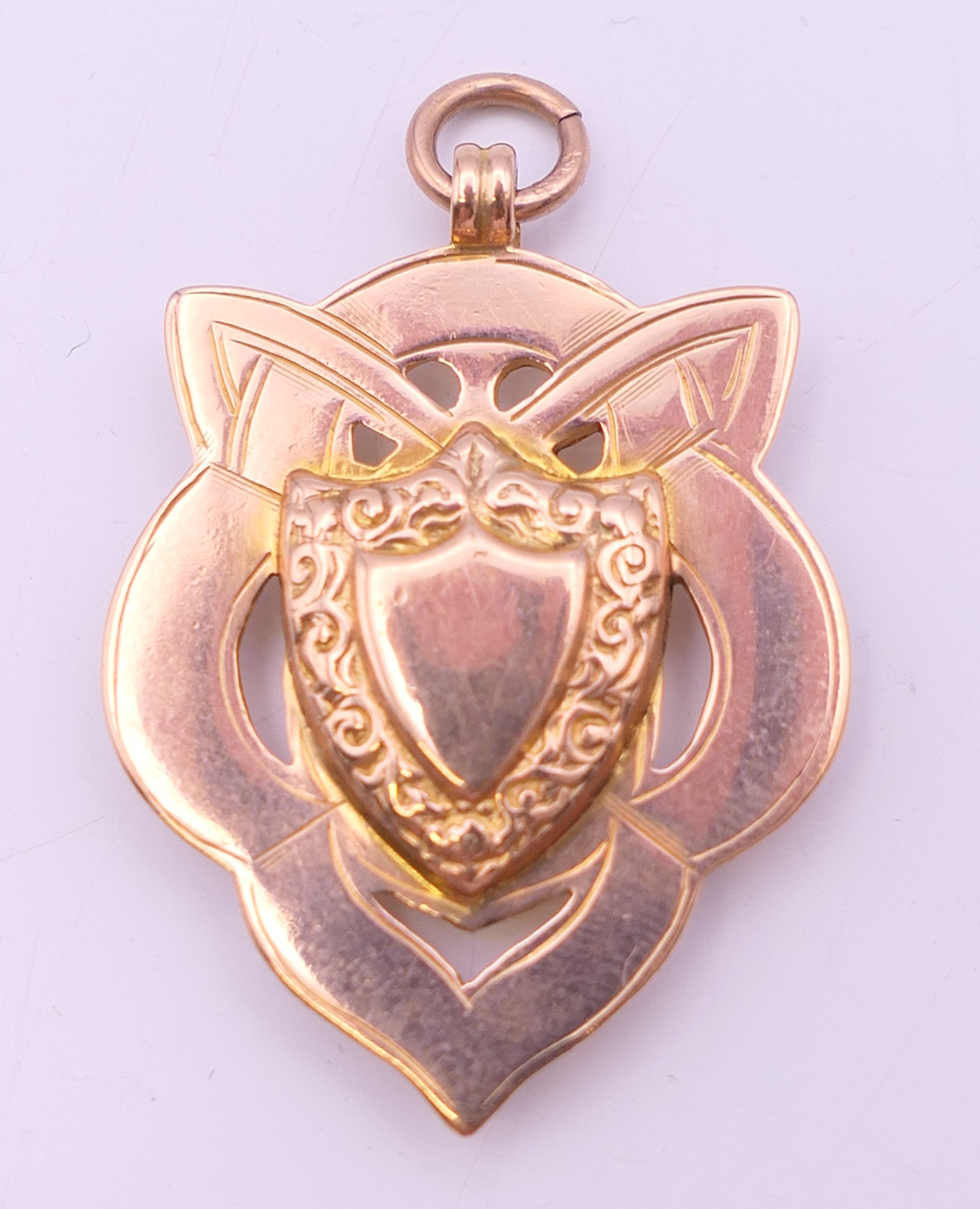 A 9 ct gold fob, hallmarked for Birmingham 1915, maker's mark of Ce & FD Ld. 3.5 cm high. 6.