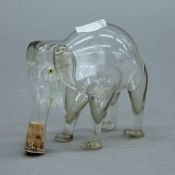 A small glass bottle formed as an elephant. 6.5 cm high.