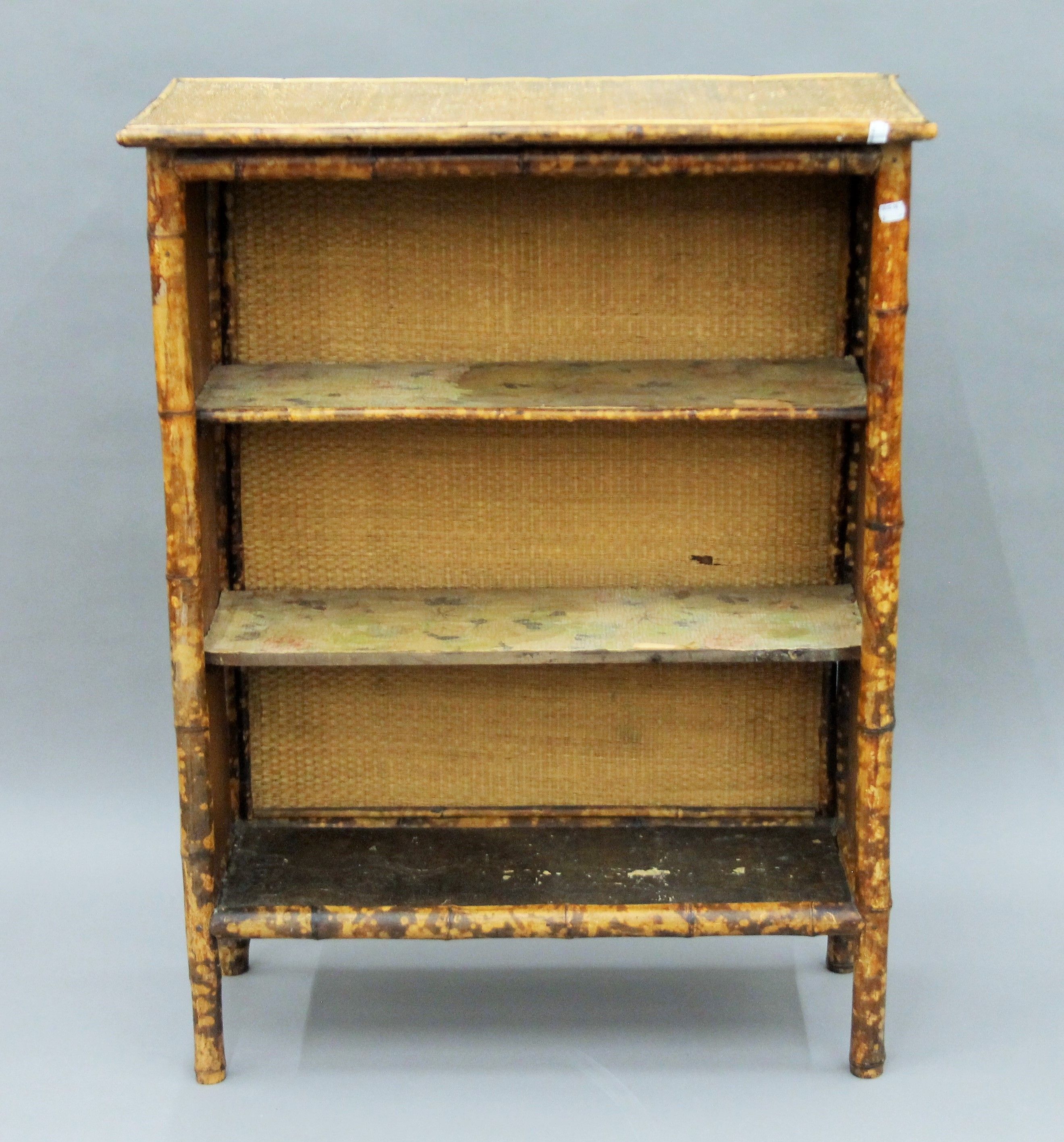 A Victorian bamboo bookcase. 77.5 cm wide.