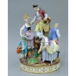 A large late 19th century Meissen porcelain figural group of gardeners. 29 cm high.