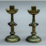 A pair of late 19th century Gothic revival brass candlesticks. 16 cm high.