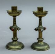 A pair of late 19th century Gothic revival brass candlesticks. 16 cm high.