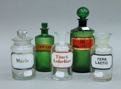 Five assorted glass Apothecary's bottles. The largest 21.5 cm high.