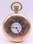 A gold plated half hunter pocket watch. 5 cm diameter.