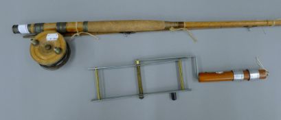 A vintage fly fishing rod and reel, and vintage line winder.