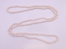A string of pearl beads. 120 cm long.