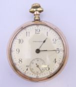 A gold plated open faced Waltham pocket watch. 5.5 cm diameter.