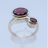 A garnet crossover ring. Ring size P/Q.