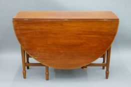 A 20th century drop leaf table. 48 cm wide leaves down.