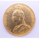 An 1887 jubilee head Victorian gold sovereign.