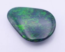 A black opal doublet. 2.25 cm long.