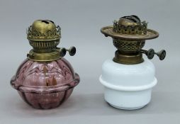 Two Victorian hanging oil lamp reservoirs. Each approximately 18.5 cm high.