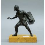 A bronze figure of a warrior on a marble base. 14.5 cm high.