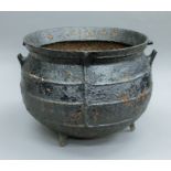 A large antique cast iron cauldron. 51 cm high.