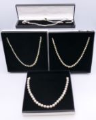 Four various cultured pearl necklaces.