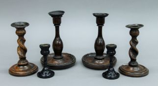 Three pairs of wooden candlesticks. The largest 19 cm high.